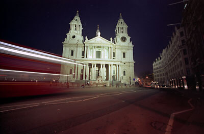 St. Paul's Cathedral, nightshot from Ludgate Hill with a bus passing by.