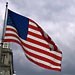 A US flag waving on a windy Chicago day. Looking over the Chicago River towards East Wacker Drive.