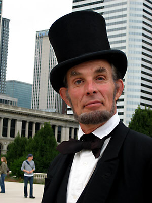 In Millenium Park, this Abraham Lincoln impersonator posed for photos for tourists.