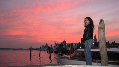 Lauri looking out over the Venetial lagoon at sunset.