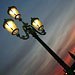 A streetlamp in Venice, Italy, at dusk. The glow is from the pink glass in the lamp.