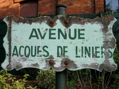 This old weathered sign for Avenue Jacques de Liniers was next to the exit in the Buttes Chaumont park in Paris.