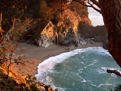 View down over the beautiful McWay Falls in Big Sur at sunset.