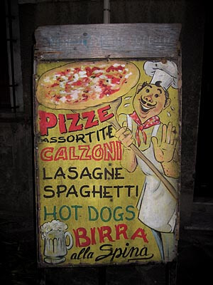 Curious sign for a pizza restaurant in Pisa, Italy.