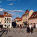 The picturesque Sfatului Square in Brasov, ringed by gothic buildings