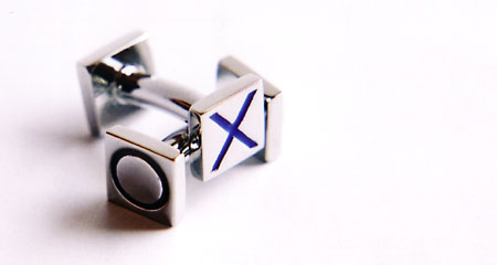 Metal cufflinks. Photographed with natural light from a window and a closeup lens. Used my Canon EOS5 SLR.