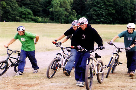 At the Bristol Bike Fest 2004 there was a dirt jump show and these guys are the showmen. They did put up a pretty good set of BMX and mountain bike tricks and dirt jumps.