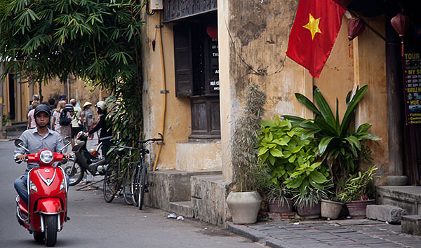 Red motorcycle and flag in Vietnam