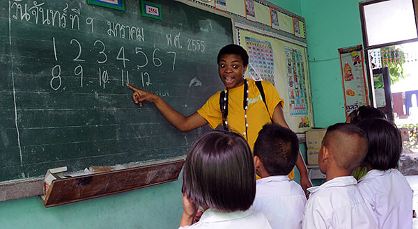 A teacher in front of a class in Thailand