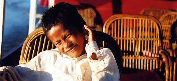 Kid on a boat in Asia