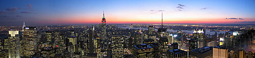 A panorama over New York City at night.