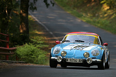 Classic car driving along Rias Altas in Spain