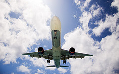 Airplane against a blue sky - photo by matt.hintsa