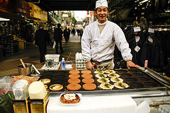 Okonomiyaki chef at his frying table