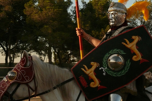 Roman centurion with mask riding a horse