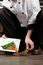 Waiter picks up food from the floor