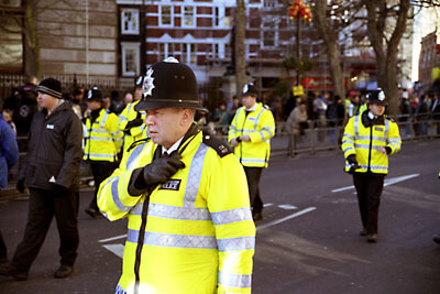Police officers bringing up the rear of the parade. Chinese New Year 2006, London.