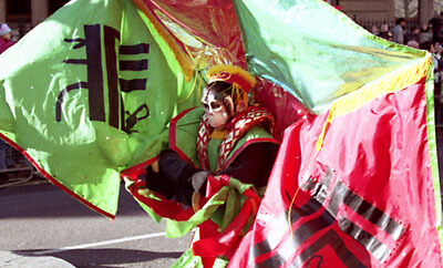 Monkey-costumed participant in the Chinese New Year parade. London, 2006.