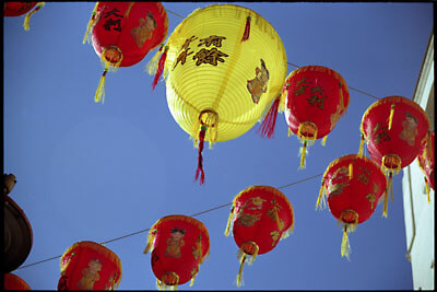 Strings of Chinese Lanterns against the blue sky. Chinese New Year, London, 2006.