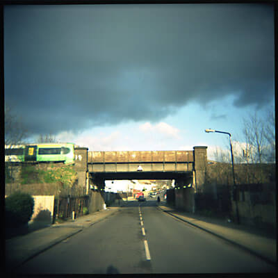 Train going over a bridge. London, England. Shot with Holga.