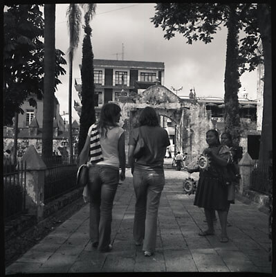 A woman and her daughter trying to sell souvenirs to tourists in Mexico.