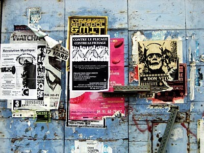 Some pretty ratty posters on a wall in Marseille