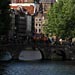 View over a canal in Amsterdam with an old church in the background.