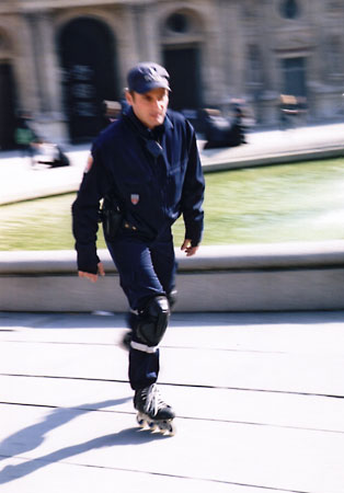 Cop on rollerblades in Paris.